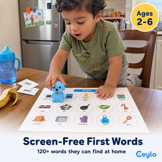 Toddler setting the Ceyla Puppy Reader on the Kitchen picture board at a table, ages 2 to 6