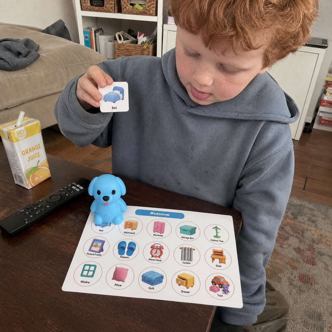 A child matching word cards with a Puppy Reader picture board