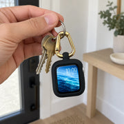 ReLoop held with house keys to show compact keychain use and scale. Watch and keys not included.