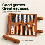 Ceyla Roam: Good games. Great escapes. Open travel backgammon set with a view of its rolled form.
