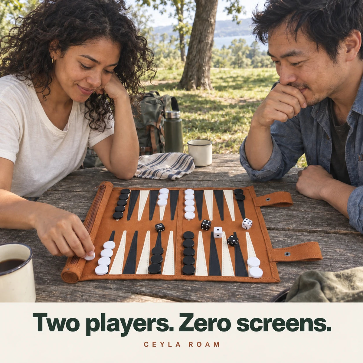 Two players. Zero screens. Adults enjoying Ceyla Roam at an outdoor picnic table.