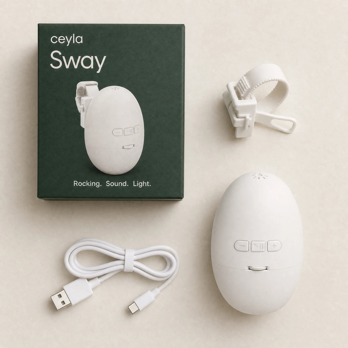 Ceyla Sway box contents: white rocker, mounting bracket with strap and USB-C charging cable