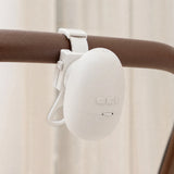 Sway’s mounting bracket and adjustable strap attached around a stroller handle