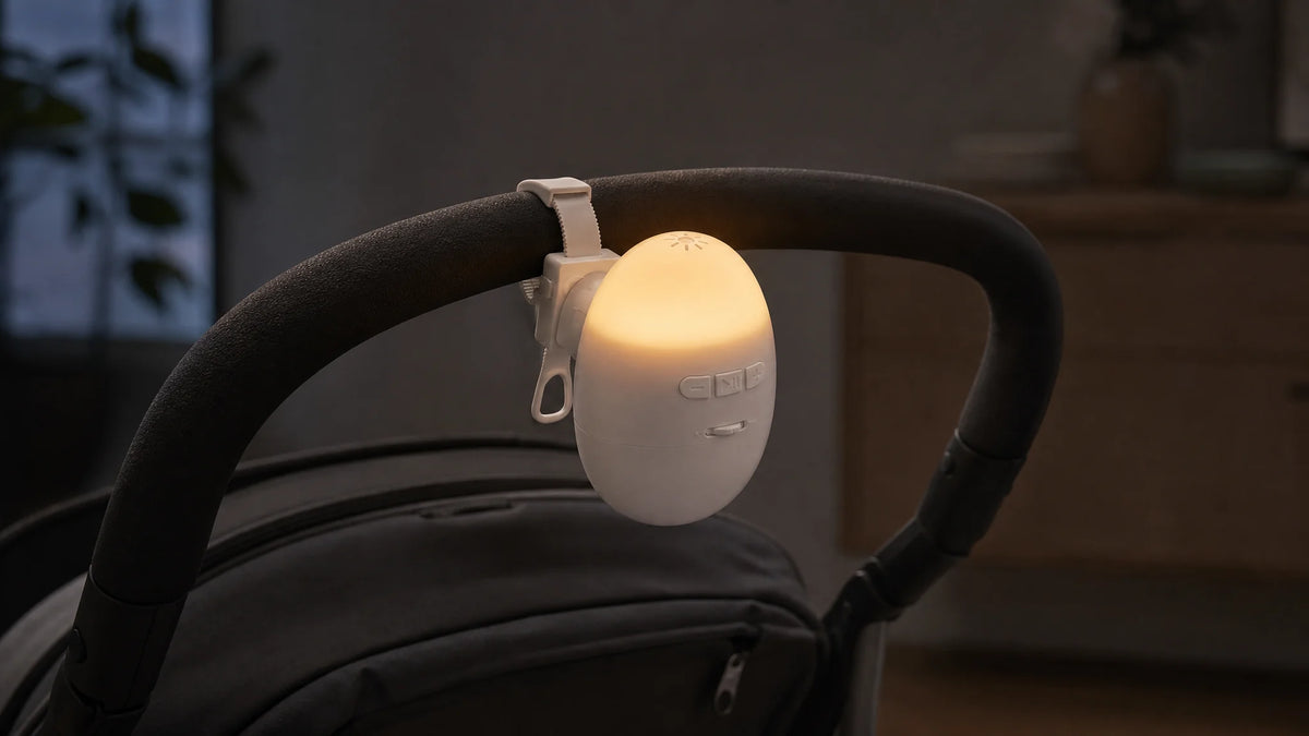 Sway’s warm dome light glowing on a stroller handle