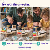 Try a first rhythm together: you tap, you pause, they try