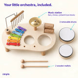 Music station with its two removable drums and two wooden mallets laid out separately