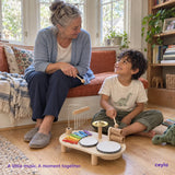 A grandparent and child sharing a musical moment at home